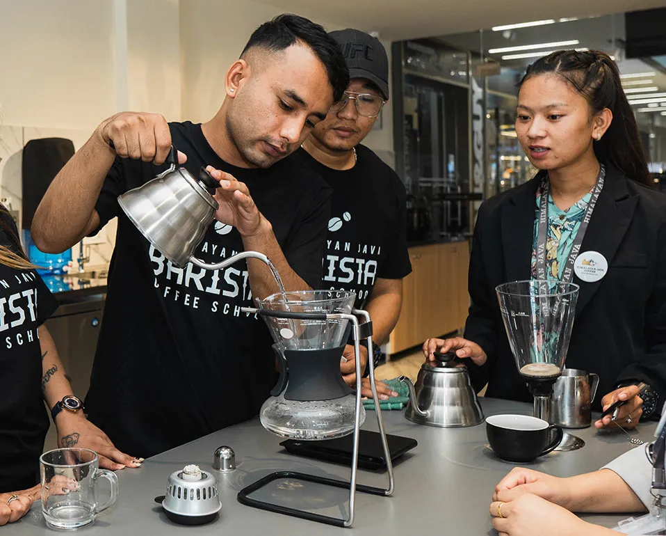 A barista pulling an espresso at the Himalayan Java barista school.