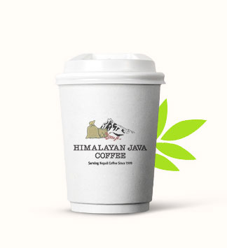 A ceramic cup of Himalayan Java coffee on a wooden table.